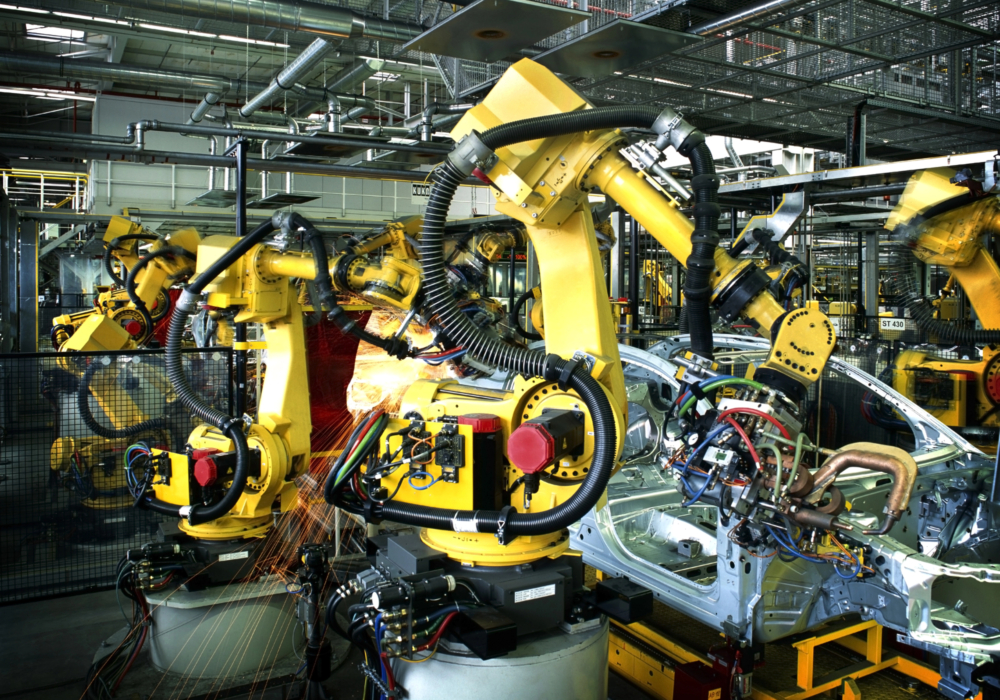 welding machines within a car production factory.